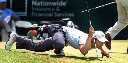 First round of the 2005 Knoxville Open at Fox Den. Camilo Villegas reads the break on his putt on the 18th green