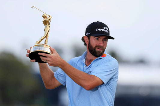 Cameron Young holds up the winning trophy after the fourth round of The Players Championship PGA golf tournament at TPC Sawgrass